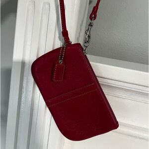 Coach fuchsia colored wristlet